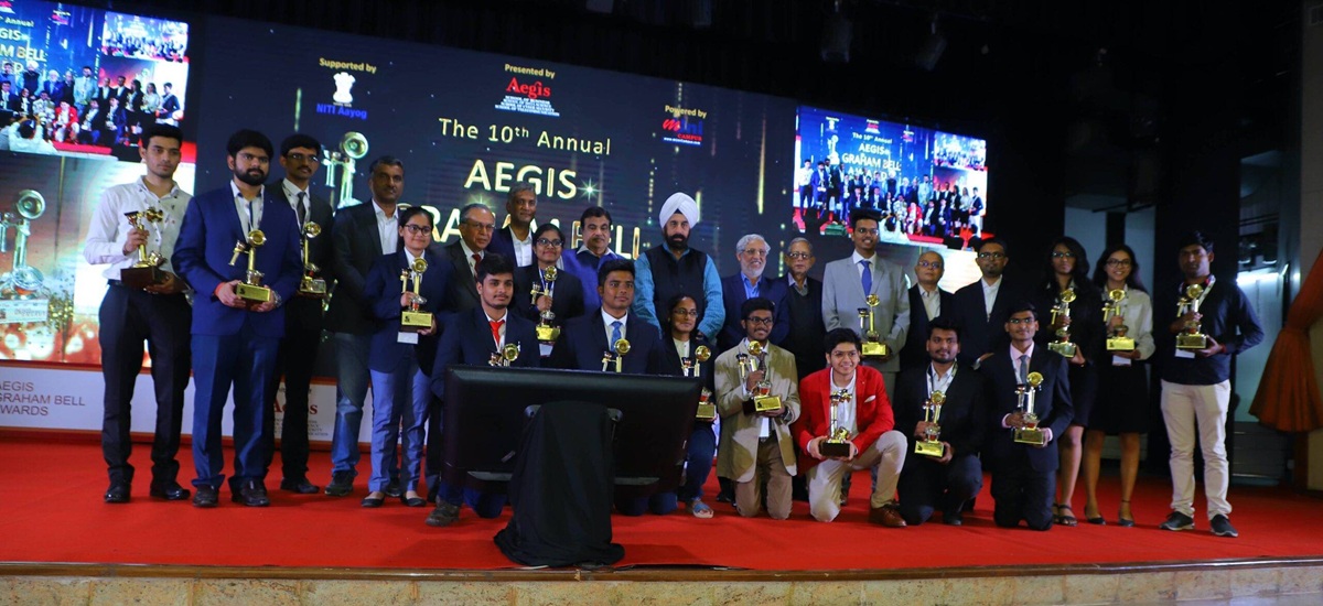 The 10th Annual Aegis Graham Bell Awards — winners on stage with trophies, presented by Aegis & Niti Aayog